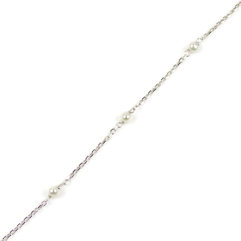 BRACCIALE ELASTICO PERLE BIANCHE E NERE - PERLA CENTRALE PORCELLA... | su MissHobby