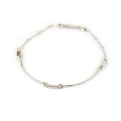 Bracciale uomo oro bianco 750 lineare con due elementi curvi, catena rolò tonda massiccia alternata a palline in oro bianco 