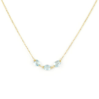 Collana oro topazio azzurro, girocollo donna in oro giallo tit 750 (18 kt) con centrale di tre pietre topazio azzurro ovale sfaccettato
